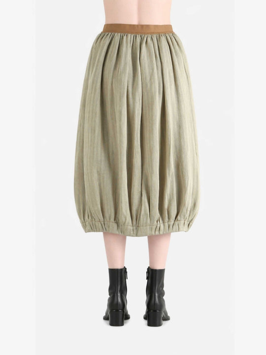 Tan skirt worn by a person, back view