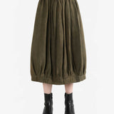 Brown skirt worn by a person, showing the skirt fit