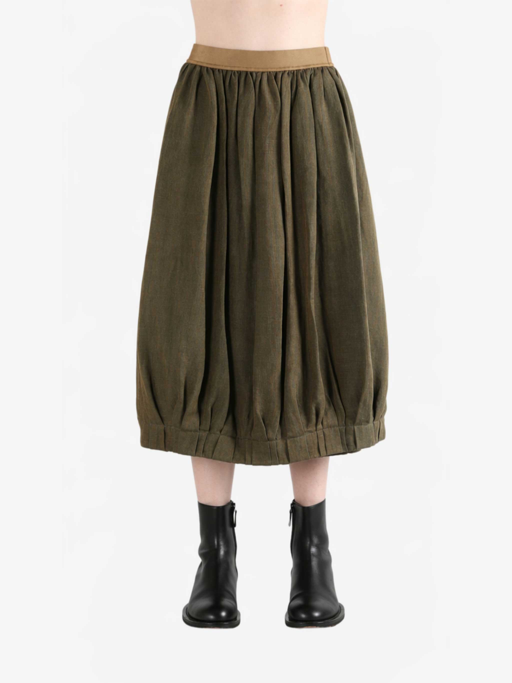 Brown skirt worn by a person, showing the skirt fit