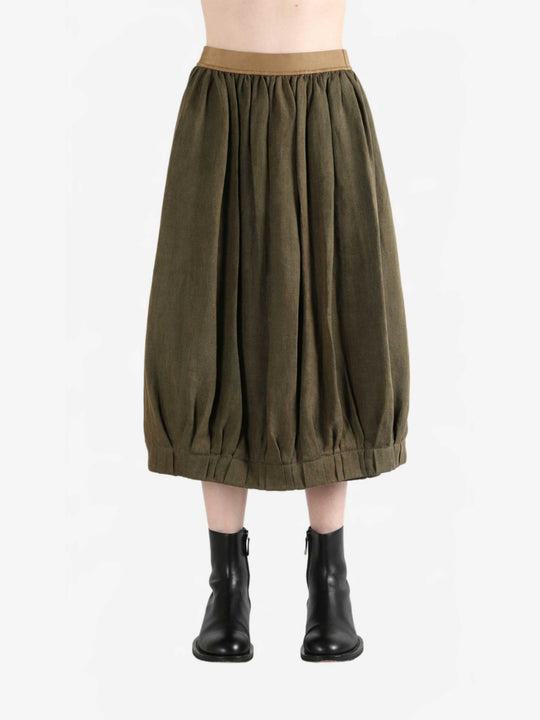Brown skirt worn by a person, showing the skirt fit