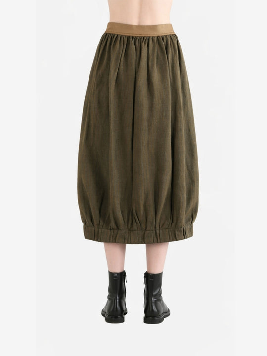 Brown skirt worn by a person, back view