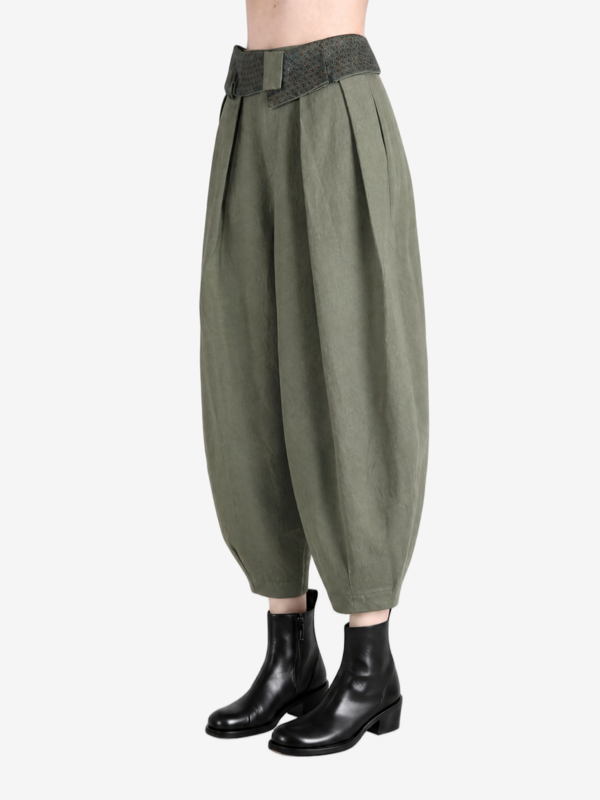 Green pant worn by a person, showing the pant's fit