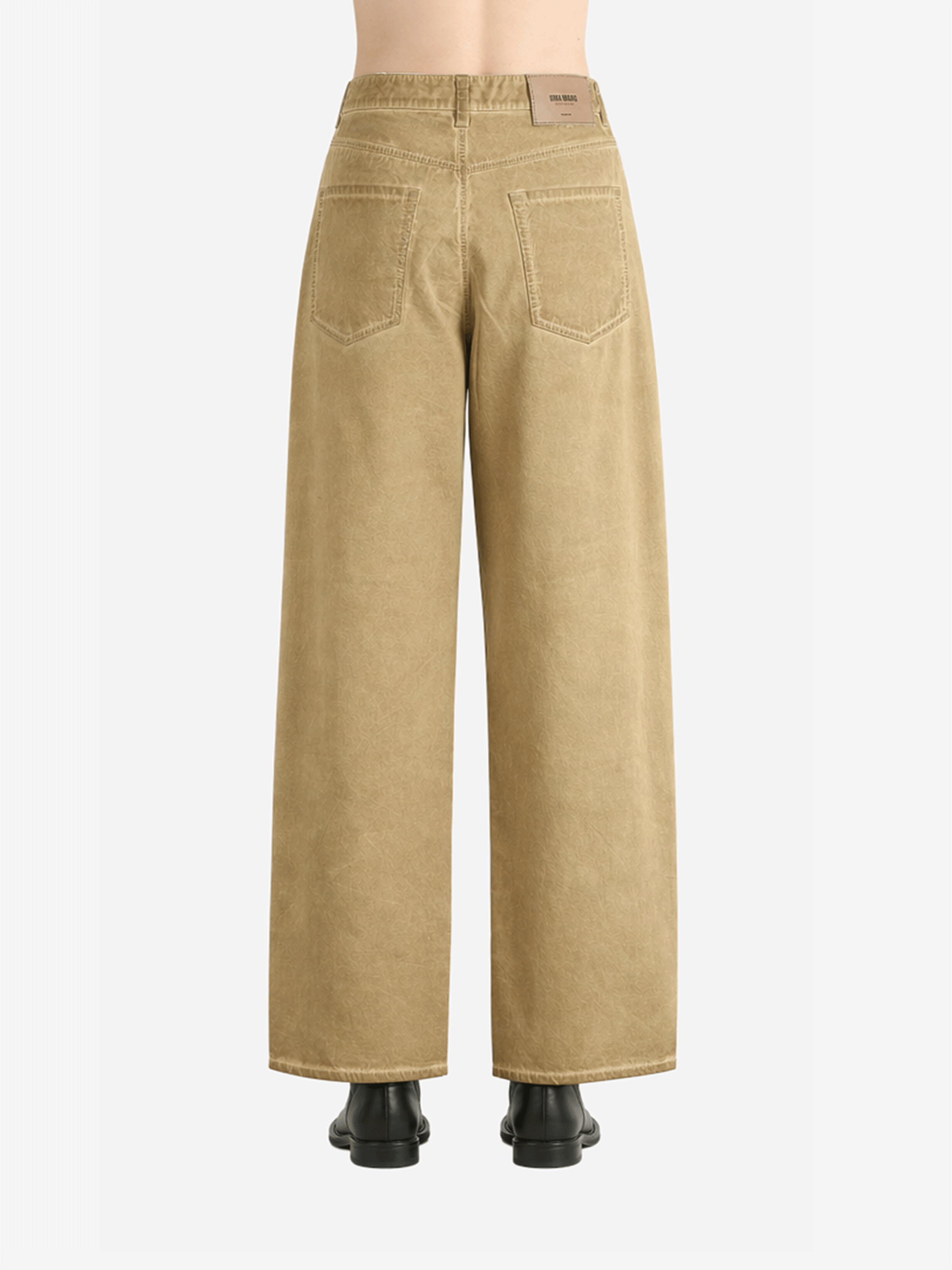 Tan pants worn by a person, back view