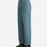 Blue pants worn by a person, showing the pants fit