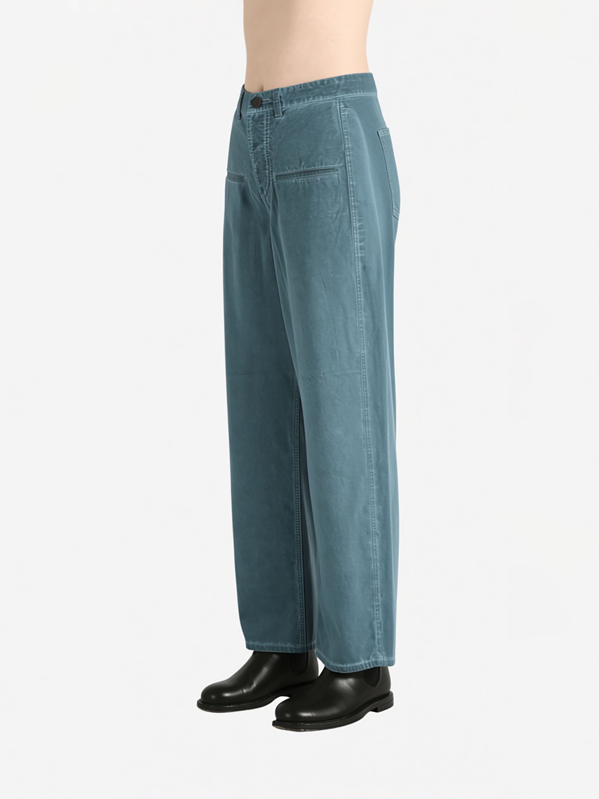 Blue pants worn by a person, showing the pants fit