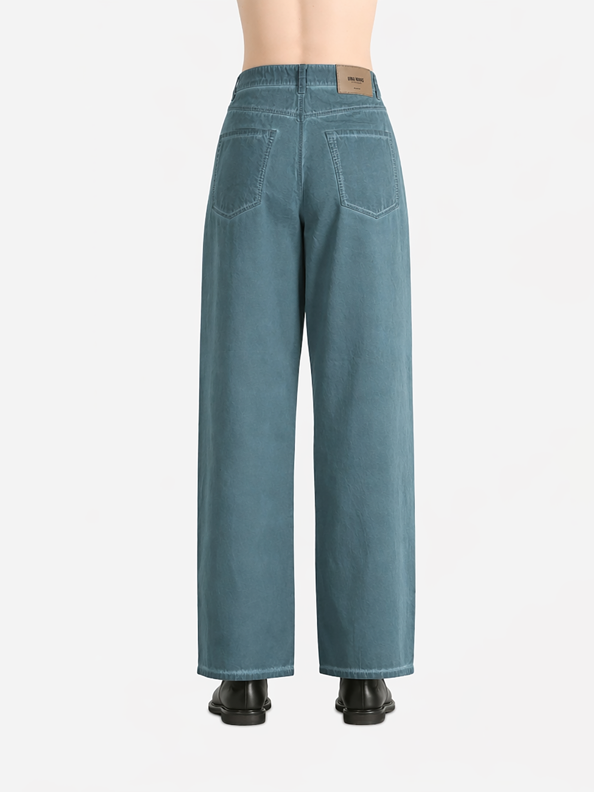 Blue pants worn by a person, showing the pants fit