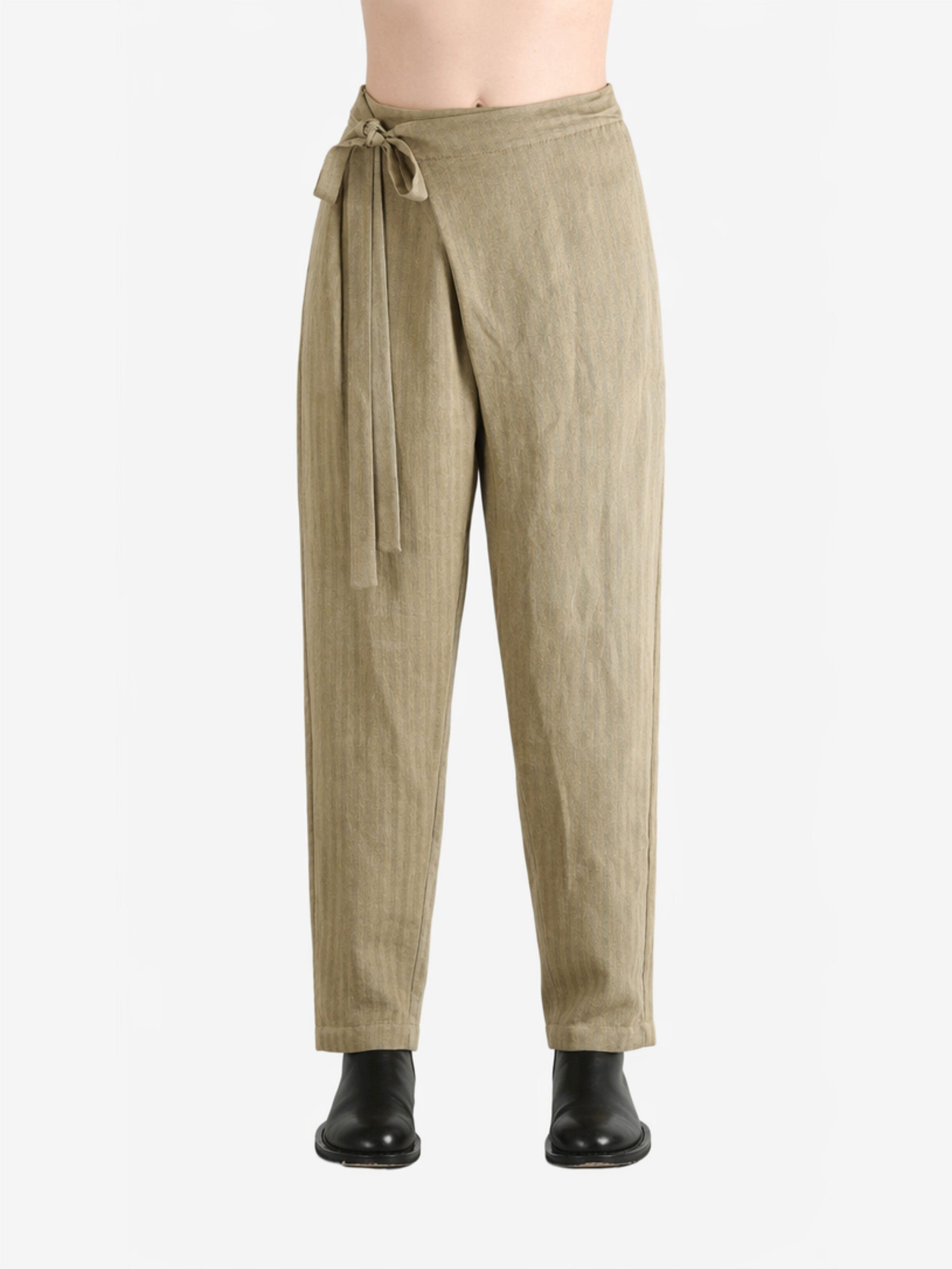 Tan pants worn by a person, showing the pants fit