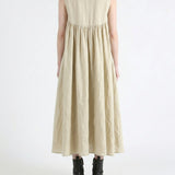 Tan dress worn by a person, back view