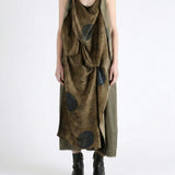 Green dress worn by a person, showing the dress fit