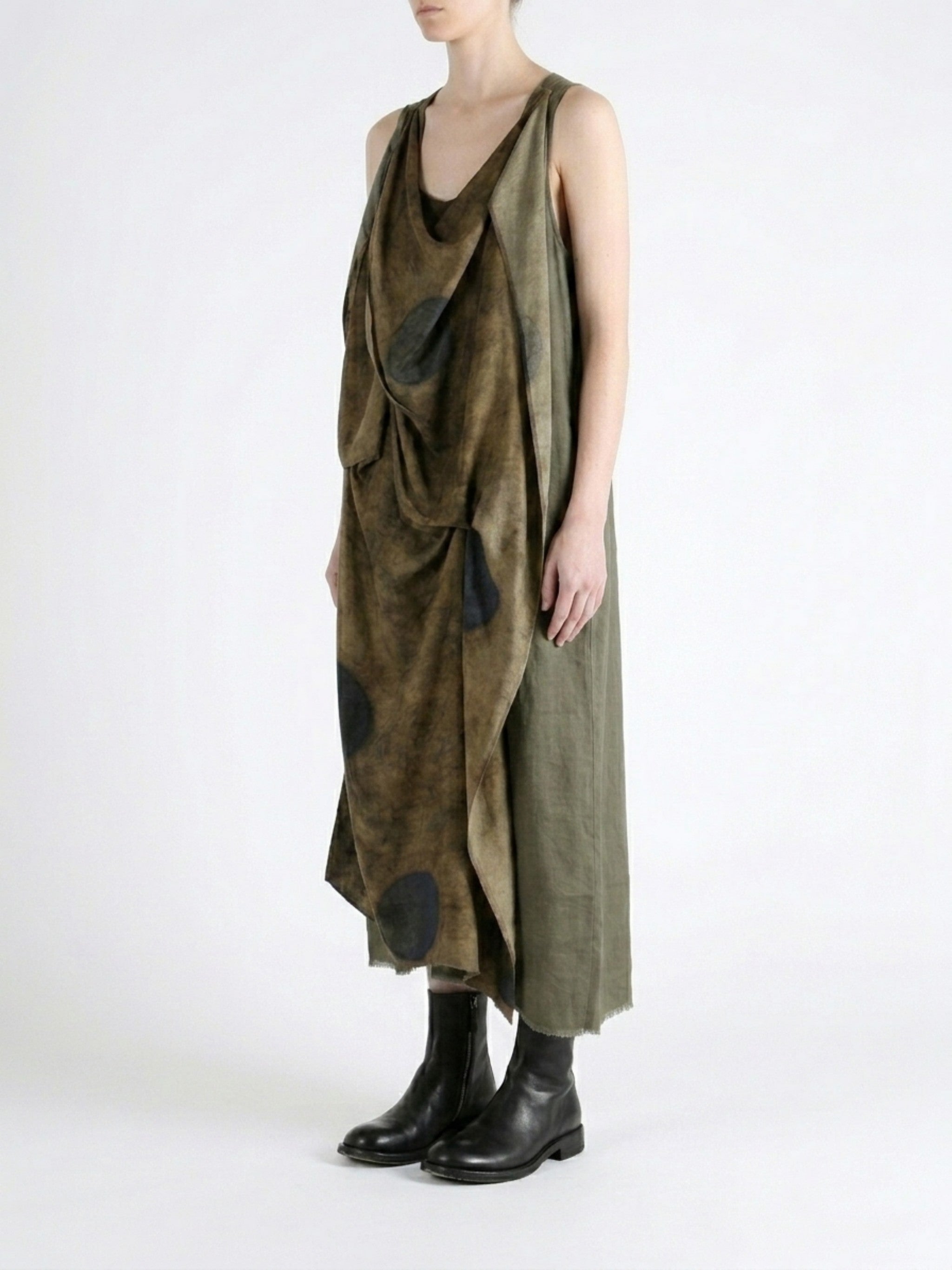 Green dress worn by a person, showing the dress fit
