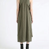 Green dress worn by a person, showing the dress fit
