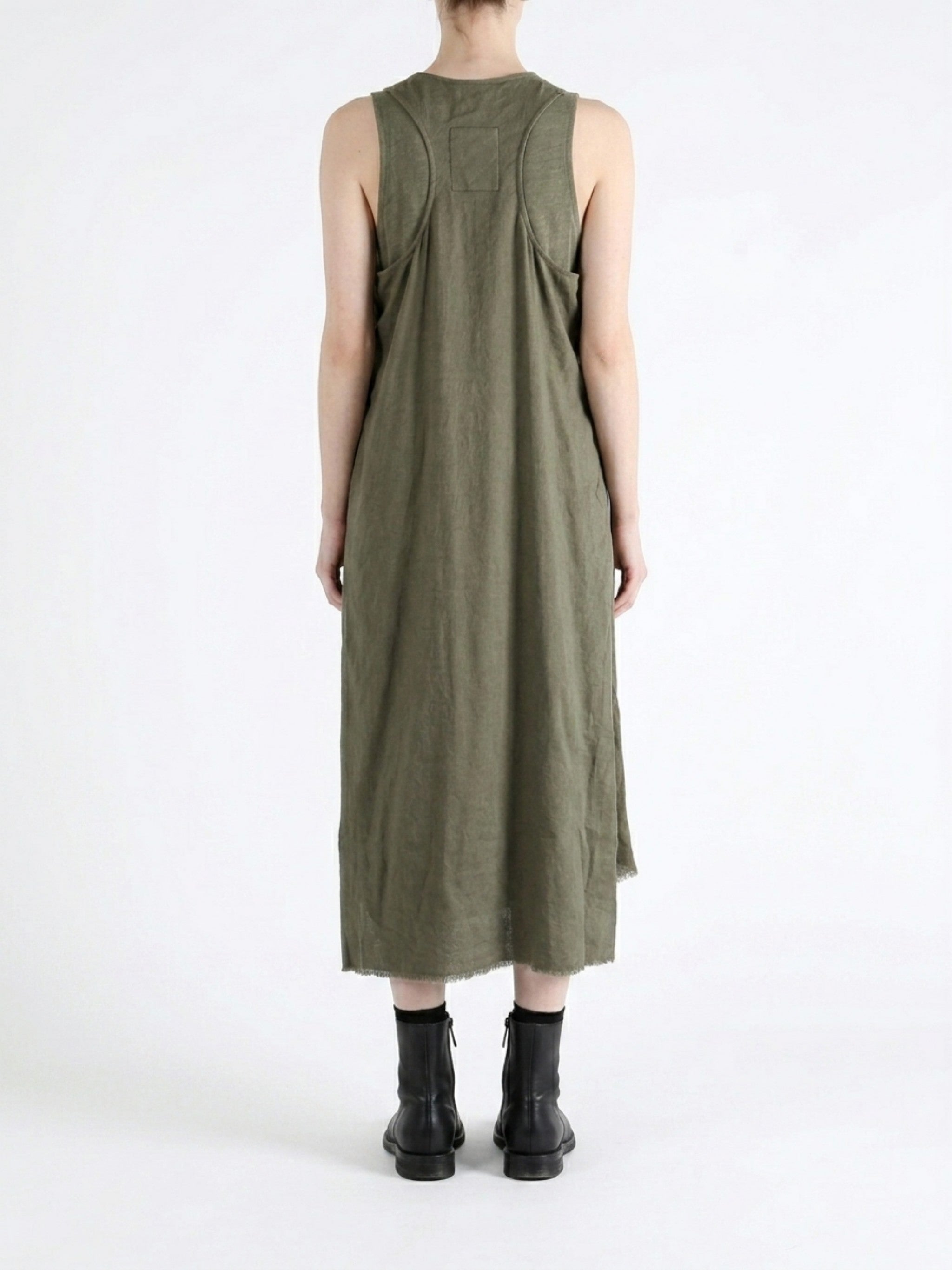 Green dress worn by a person, showing the dress fit