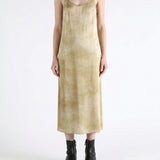 Tan dress worn by a person, showing the dress fit