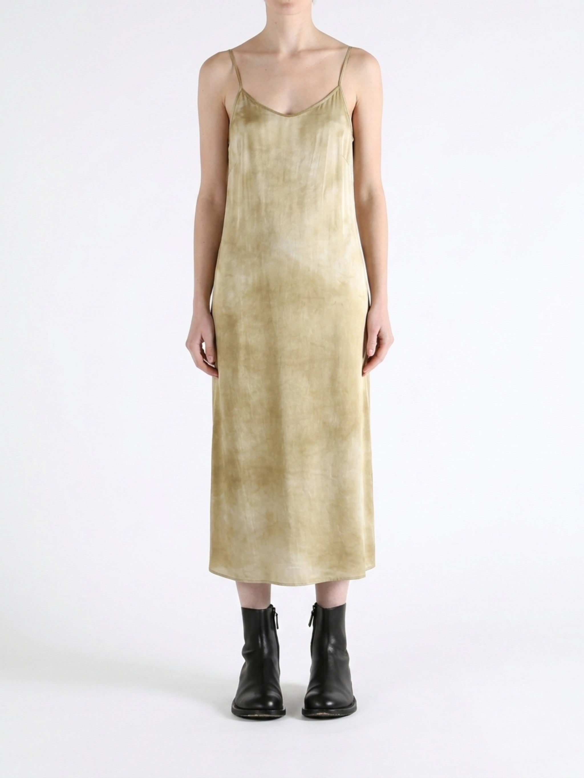 Tan dress worn by a person, showing the dress fit