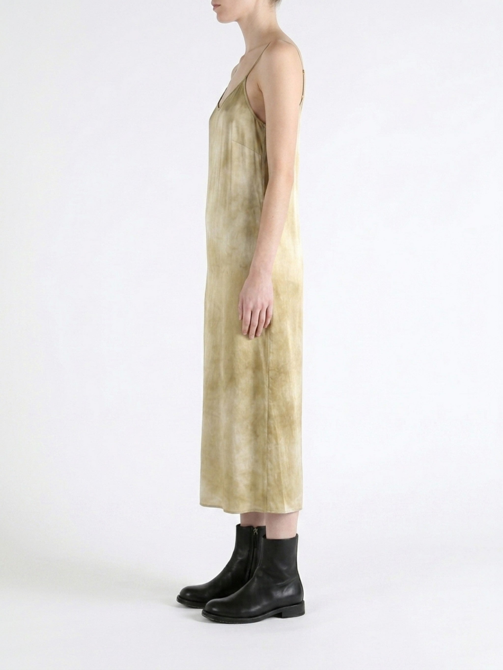 Tan dress worn by a person, showing the dress fit