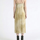 Tan dress worn by a person, showing the dress fit