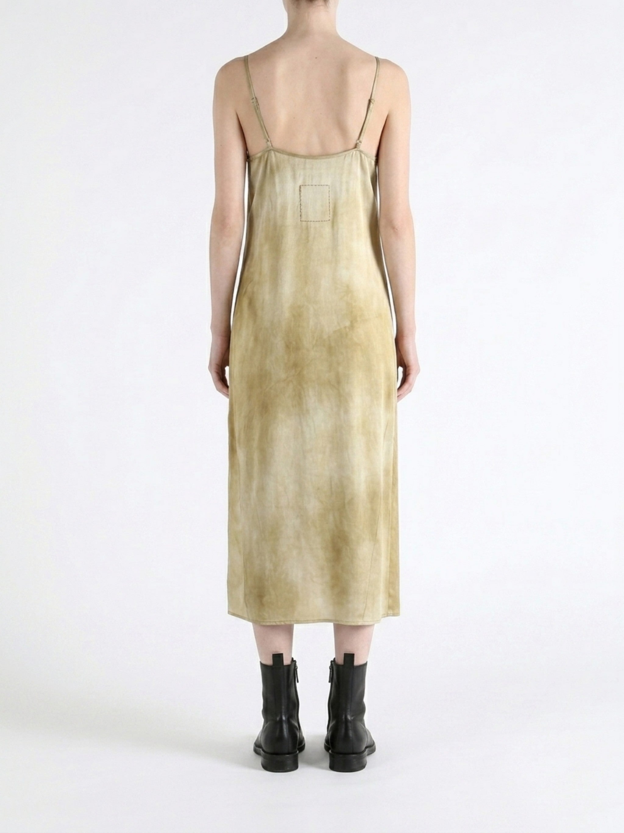 Tan dress worn by a person, showing the dress fit