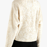 White jacket worn by a person, showing the jacket fit