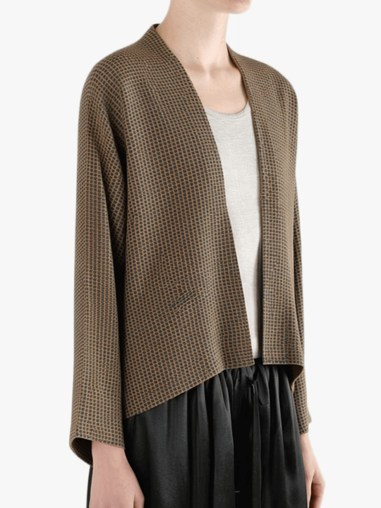 Brown jacket worn by a person, showing the jacket's fit