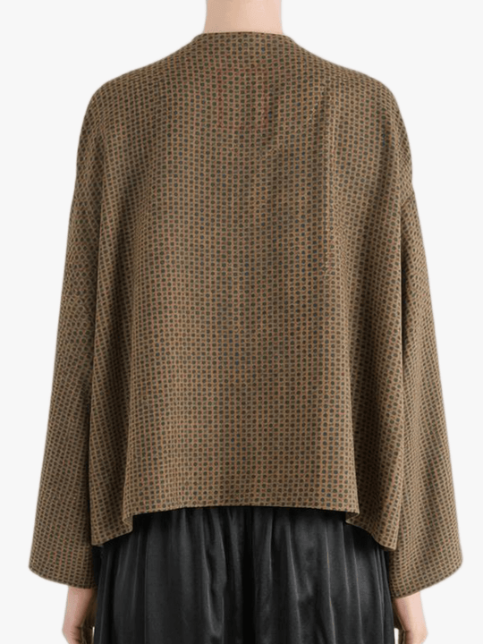 Brown jacket worn by a person, showing the jacket's fit