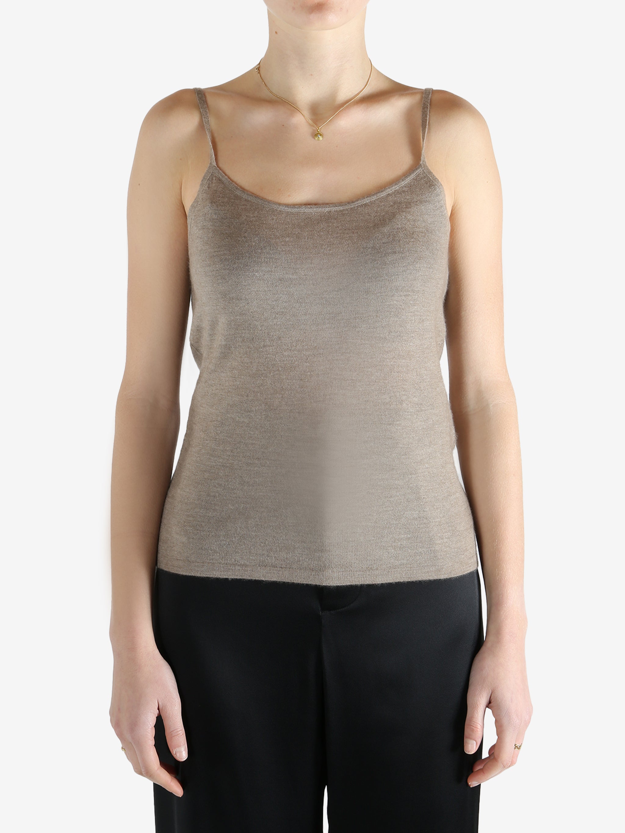 Tan knitwear worn by a person, showing the knitwear fit