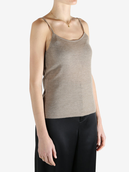 Tan knitwear worn by a person, showing the knitwear fit