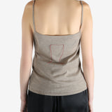 Tan knitwear worn by a person, showing the knitwear fit