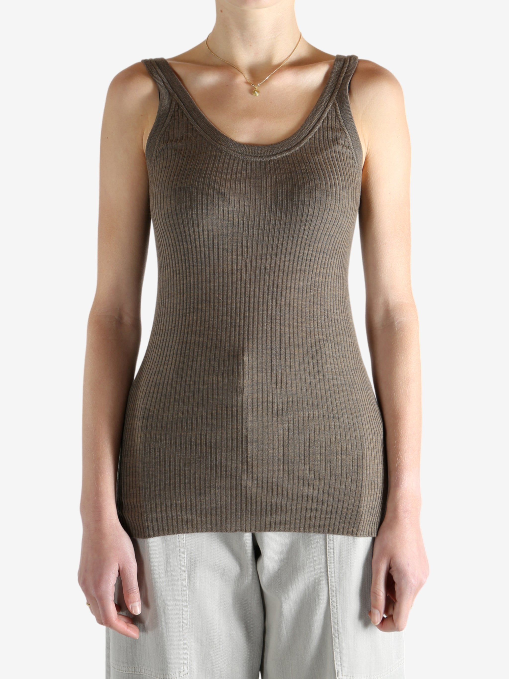 Brown top worn by a person, showing the top's fit