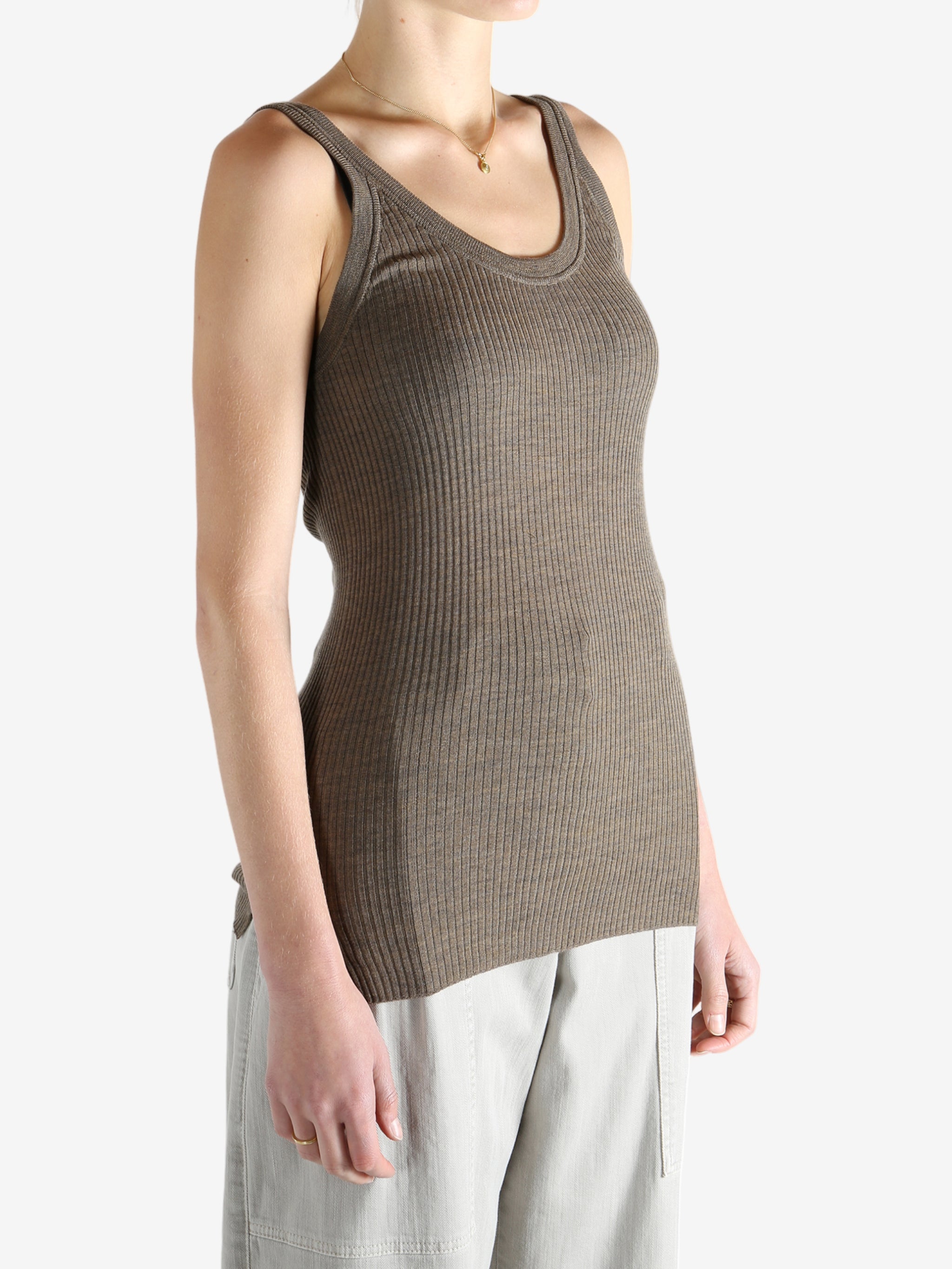 Brown top worn by a person, showing the top's fit