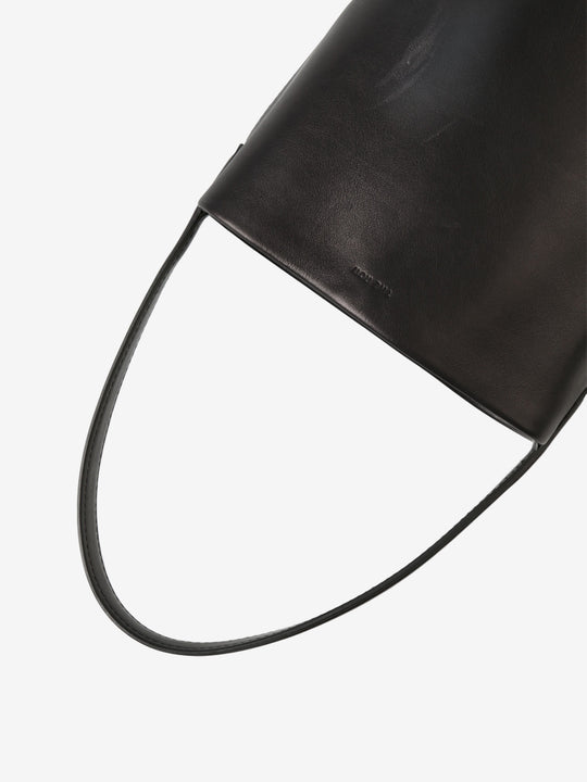 Close up of black bag, showing texture of the calf leather fabric