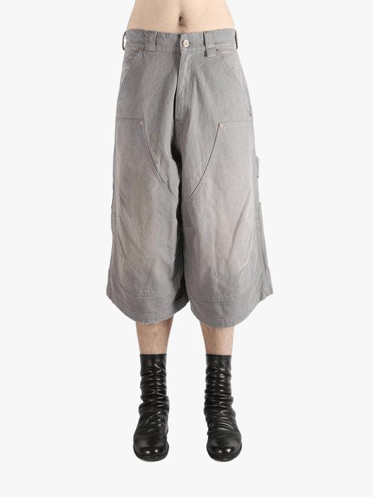 Grey shorts worn by a person, showing the shorts' fit