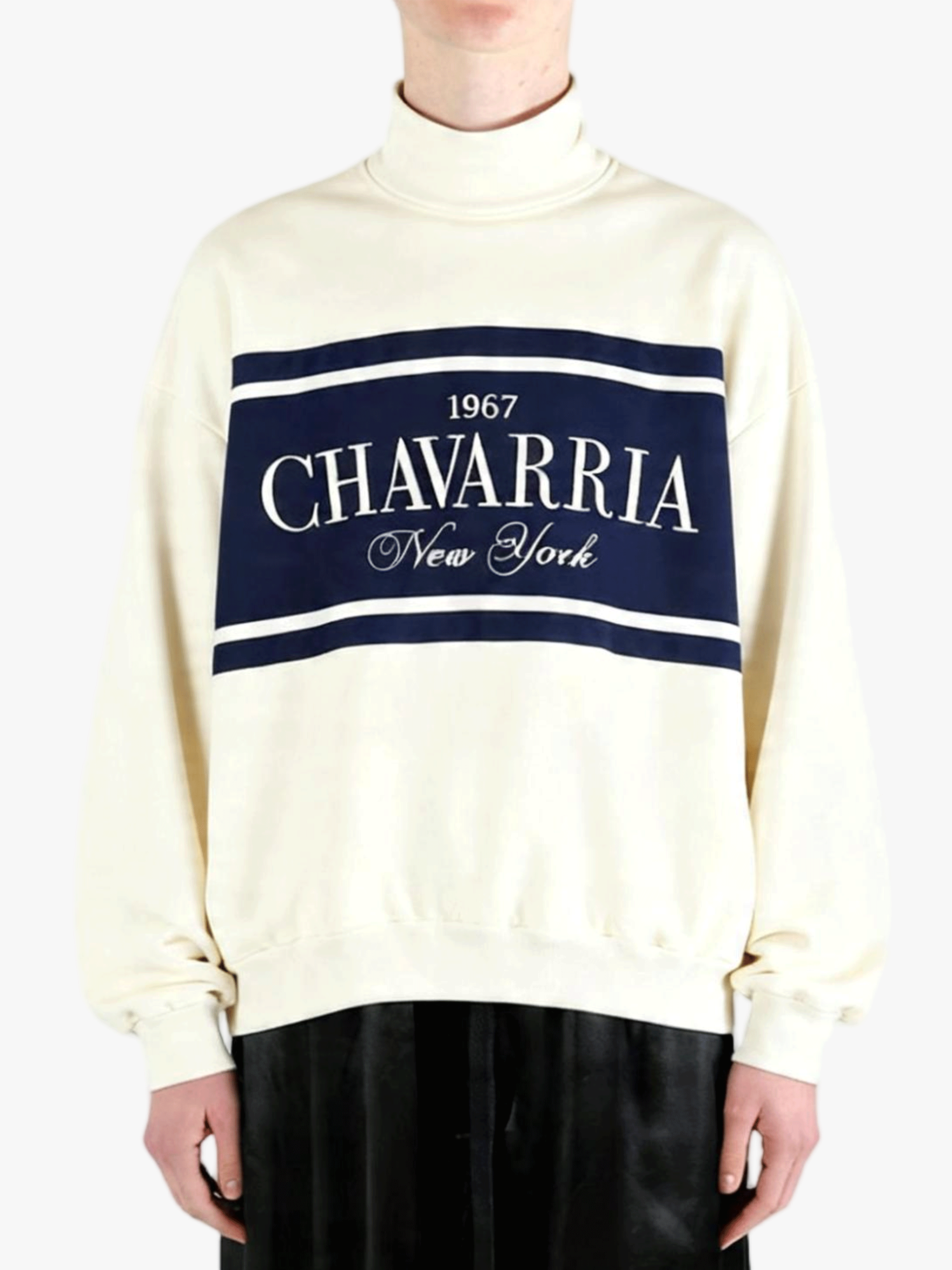 White knitwear worn by a person, showing the knitwear's fit