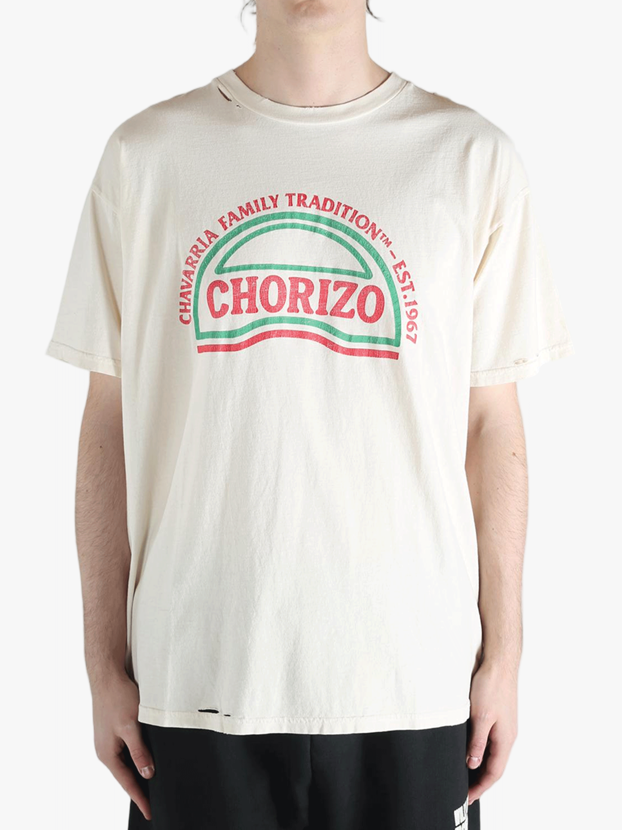 White t-shirt worn by a person, showing the shirt's fit