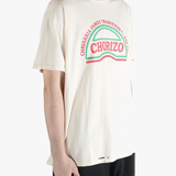 White t-shirt worn by a person, showing the shirt's fit