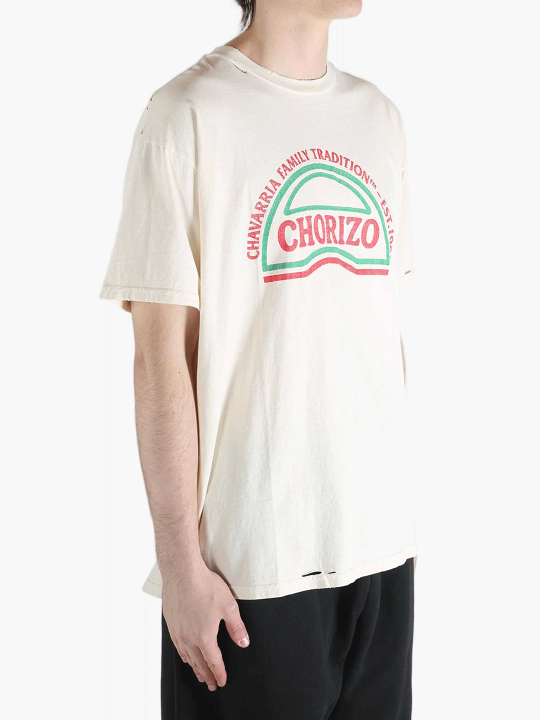 White t-shirt worn by a person, showing the shirt's fit