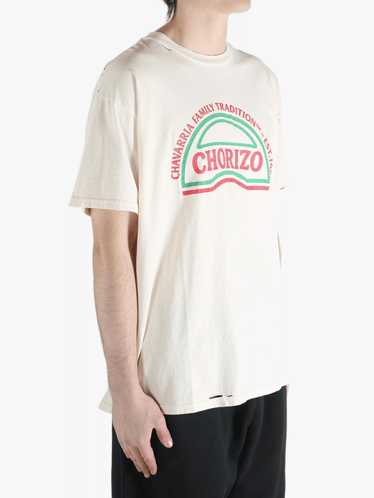 White t-shirt worn by a person, showing the shirt's fit