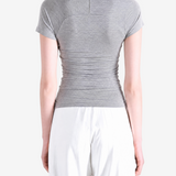 Grey top worn by a person, showing the top fit