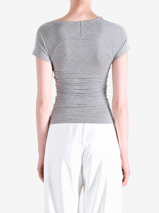 Grey top worn by a person, showing the top fit