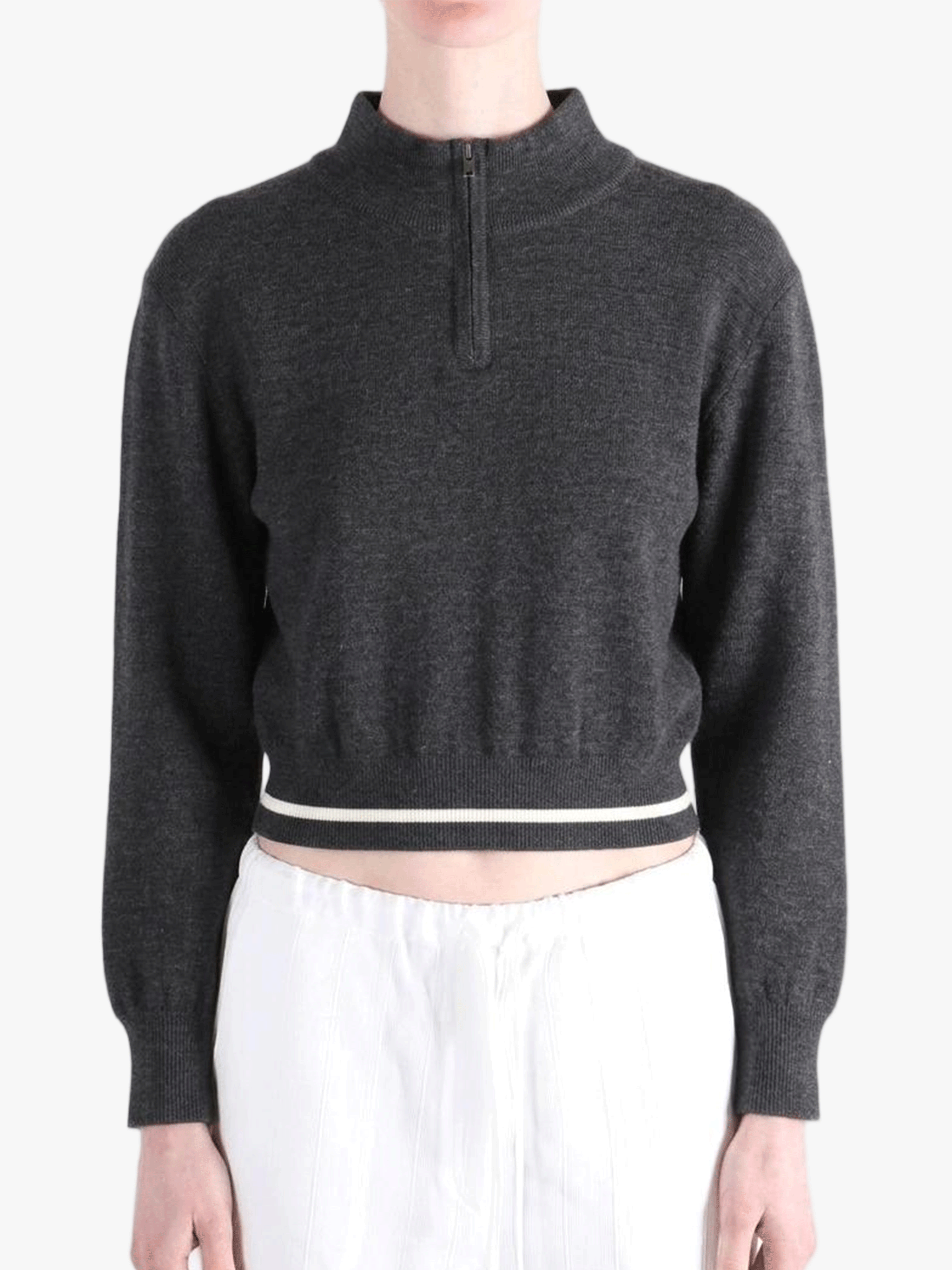 Black knitwear worn by a person, showing the knitwear fit