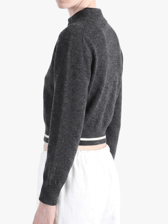 Black knitwear worn by a person, side view