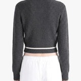 Black knitwear worn by a person, back view