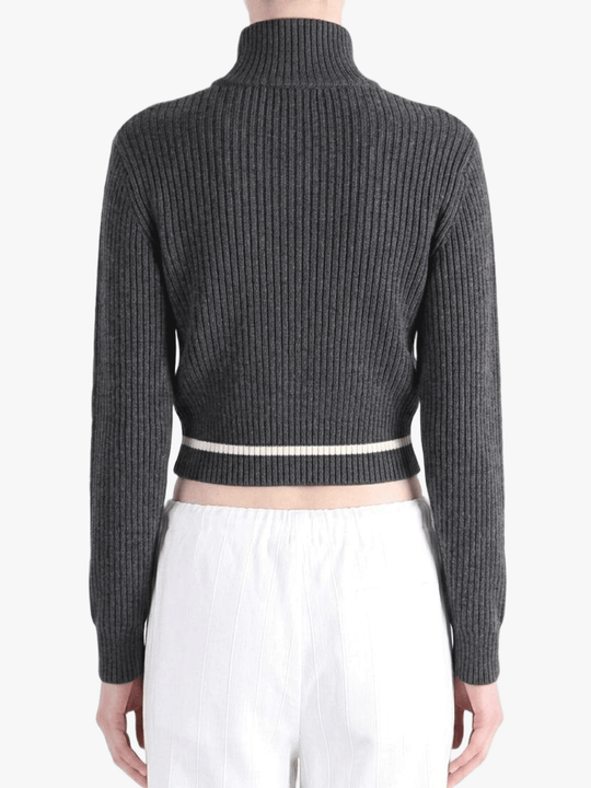 Black knitwear worn by a person, back view