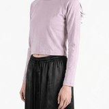 Purple top worn by a person, showing the top's fit