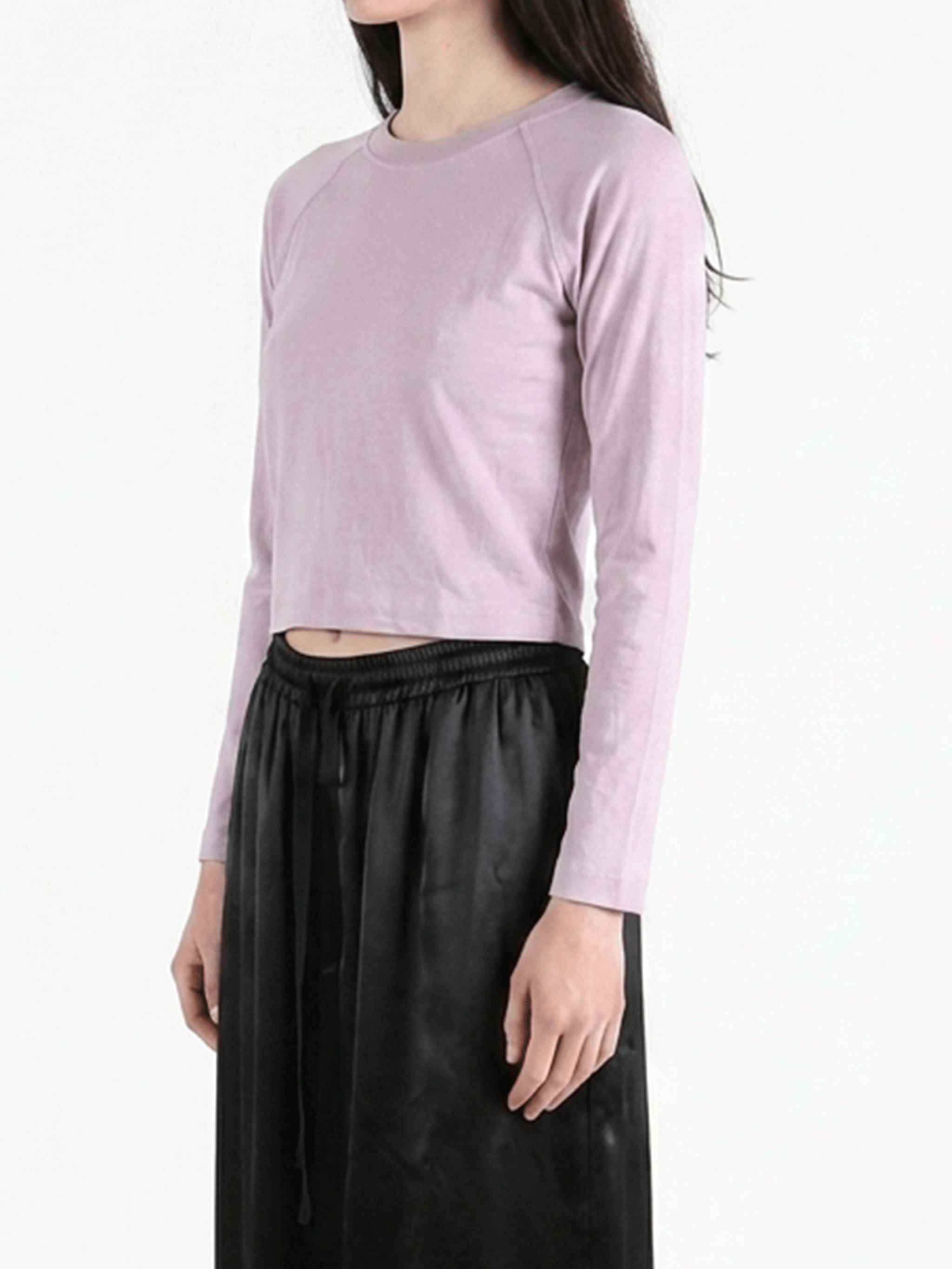 Purple top worn by a person, showing the top's fit
