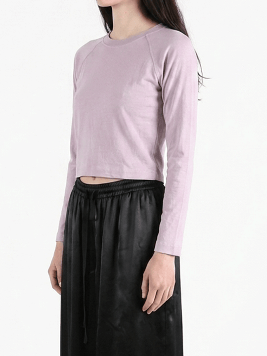 Purple top worn by a person, showing the top's fit