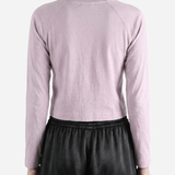 Purple top worn by a person, showing the top's fit