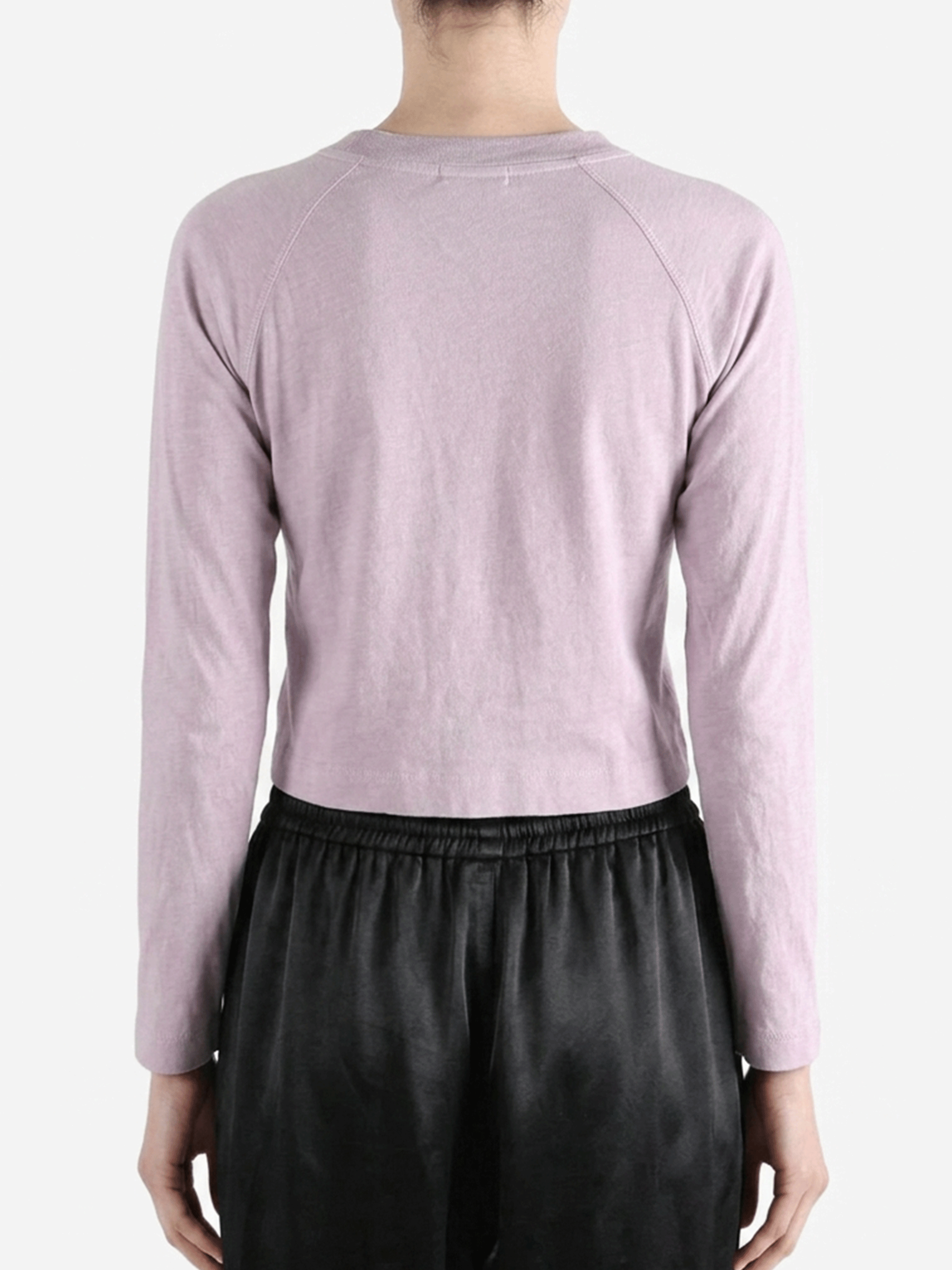 Purple top worn by a person, showing the top's fit