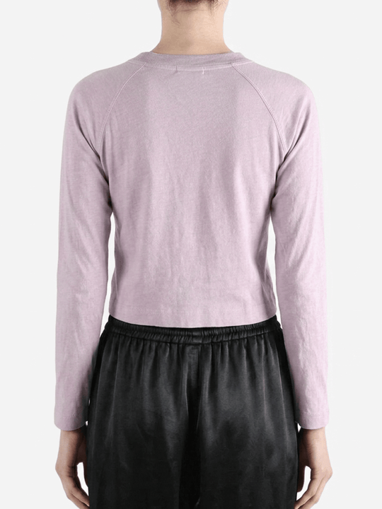 Purple top worn by a person, showing the top's fit