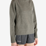 Grey knitwear worn by a person, showing the knitwear fit