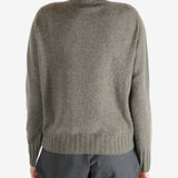 Grey knitwear worn by a person, showing the knitwear fit